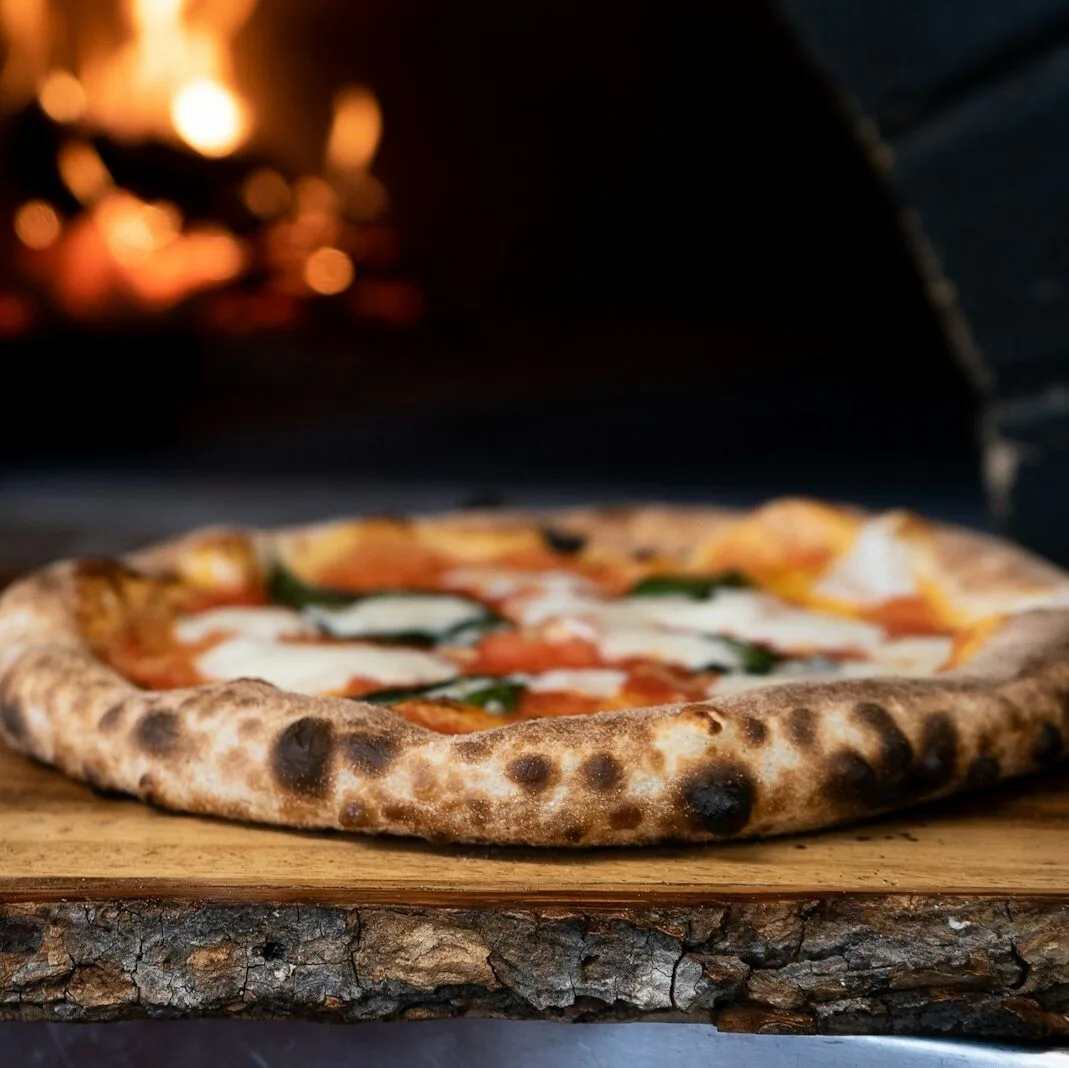 pizza on brown wooden table